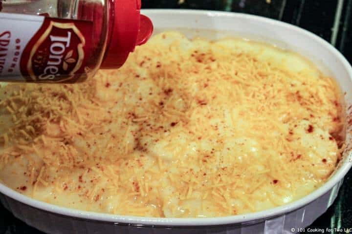 top with cheese and paprika