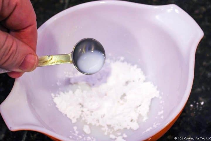 adding milk to powder sugar