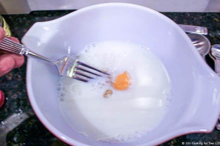 mixing egg in milk
