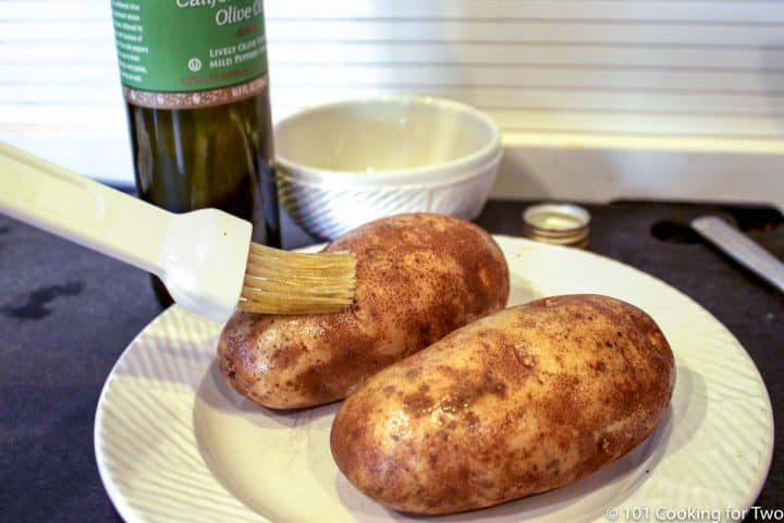 brushing potatoes with oil