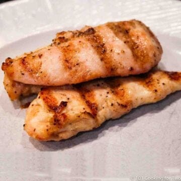 Grilled chicken tenders on a white plate