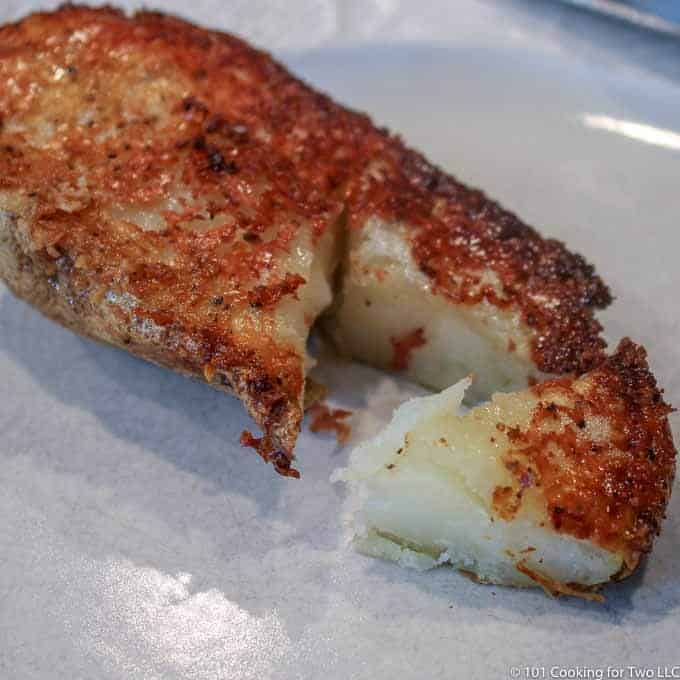 parmesan crusted potatoe on a plate
