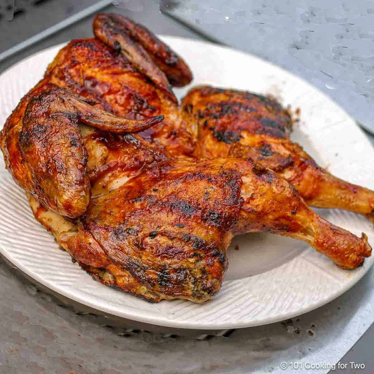 BBQ Butterflied Chicken on white plate