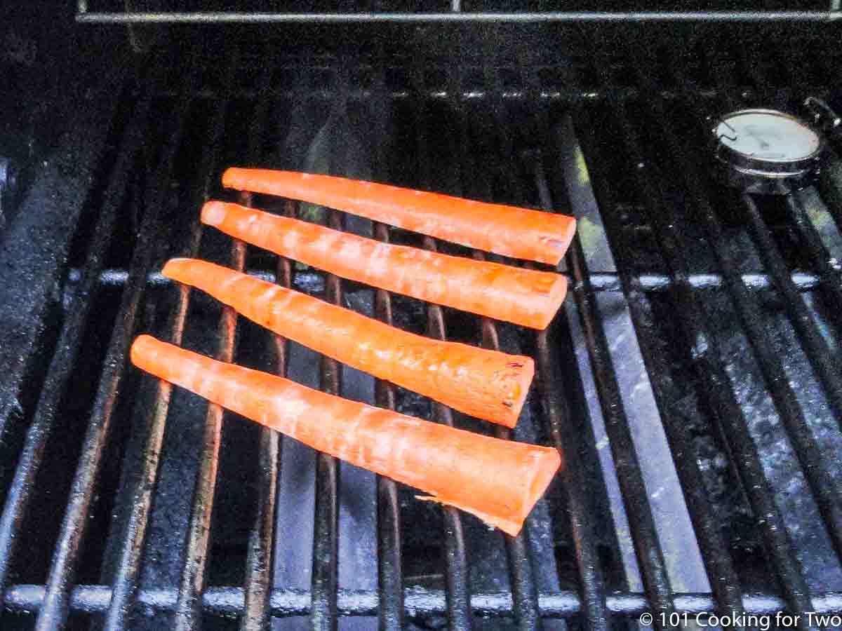 carrots on a grill grate.