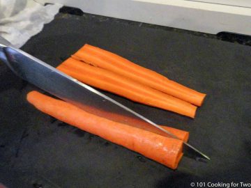 cutting carrots in half with knife