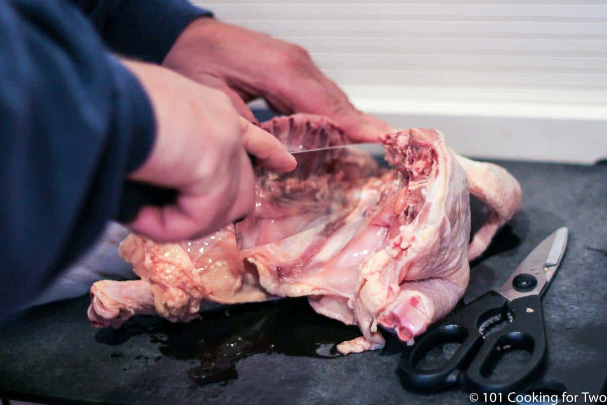 Notching breast bone with a knife.
