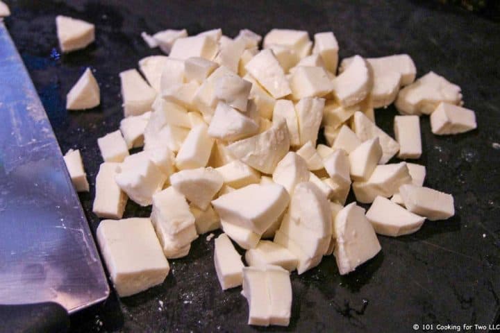 chopped fresh mozzarella cheese in black board
