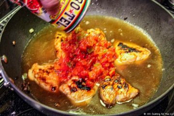 adding rotel to pan with chicken