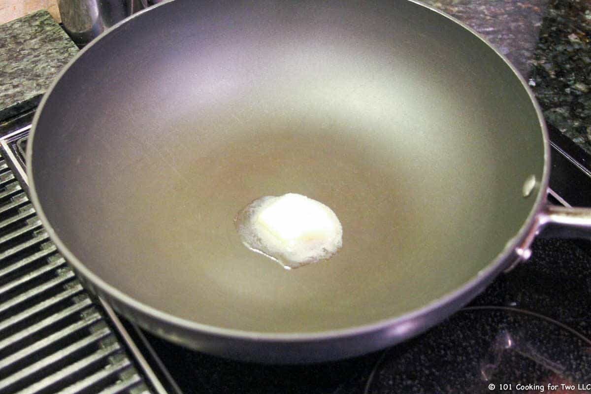 butter melting in large fry pan