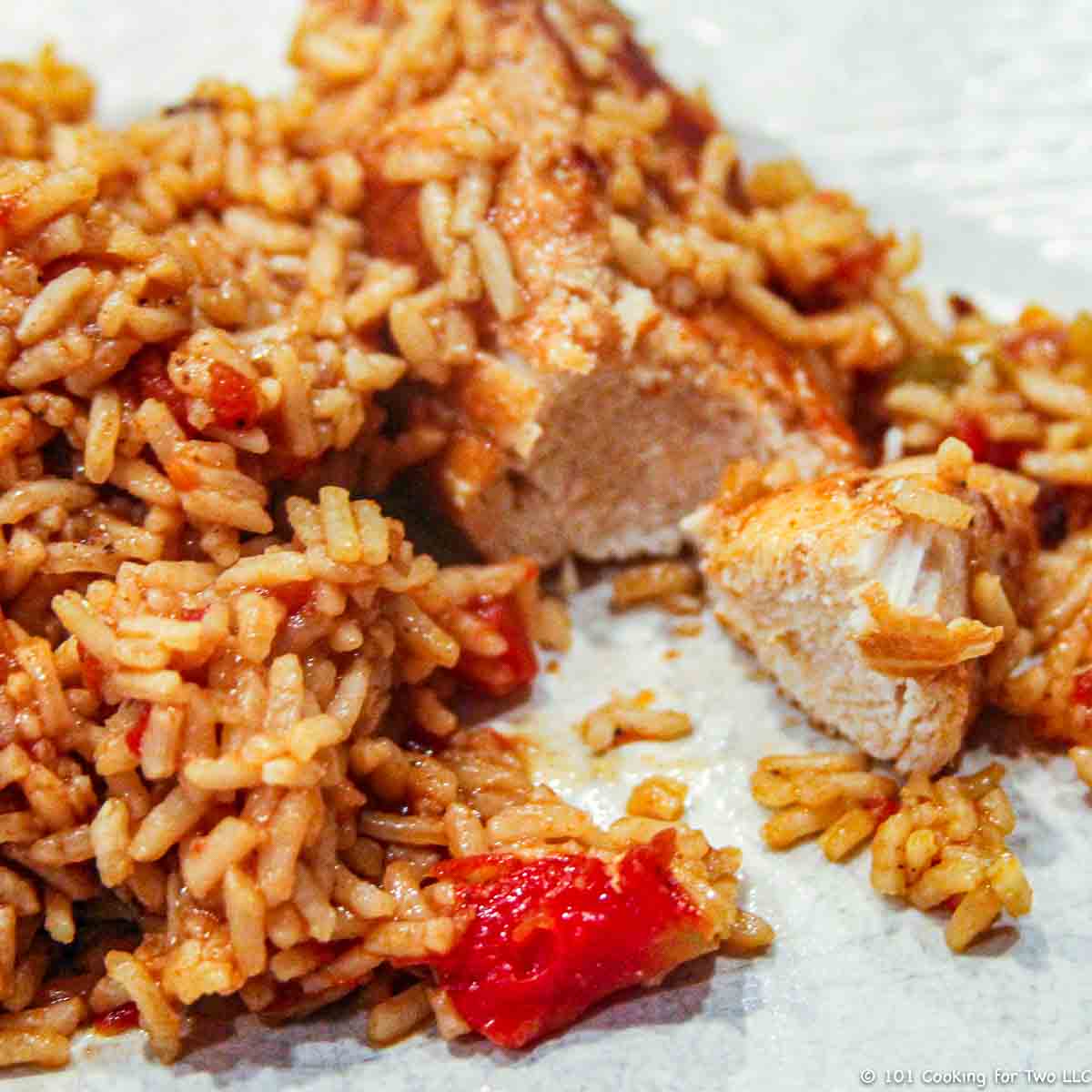 chicken and rice on white plate