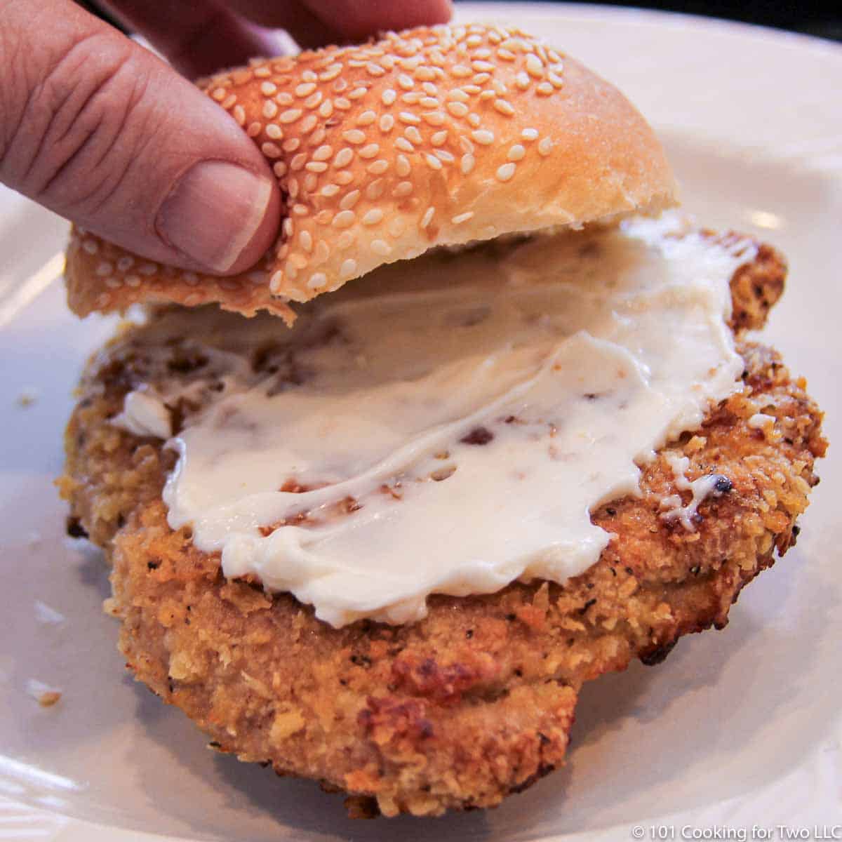 Pork Tenderloin Sandwich on white plate.