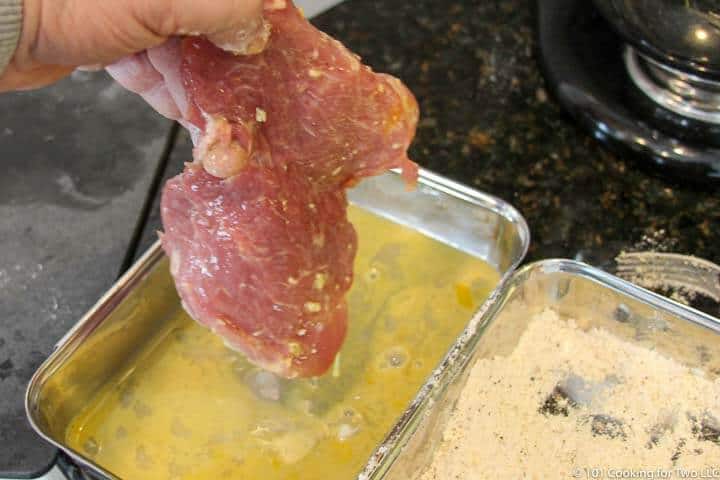 dipping tenderloin in egg wash.