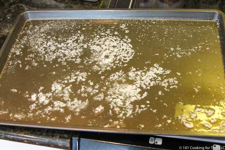 melted butter in sheet pan.