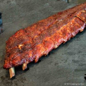 grilled Baby Back Ribs on black cutting board