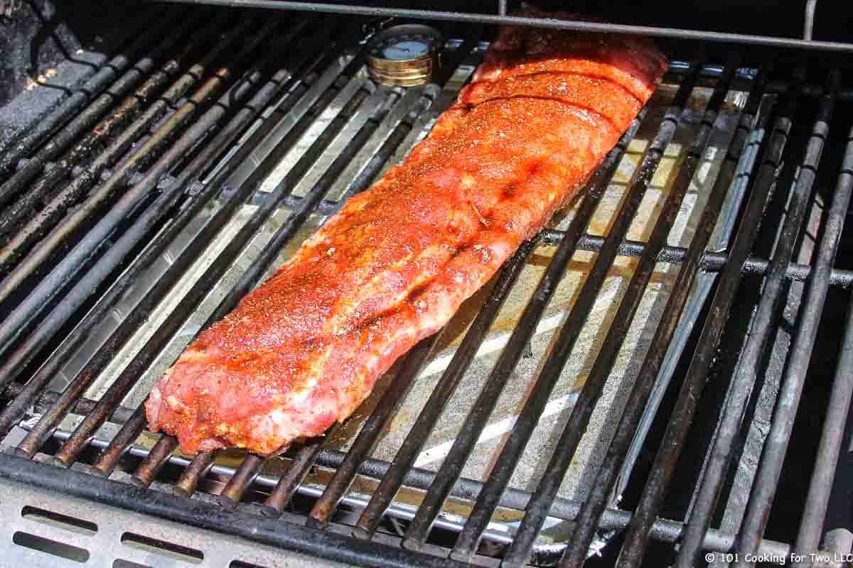 ribs on grill over pan.