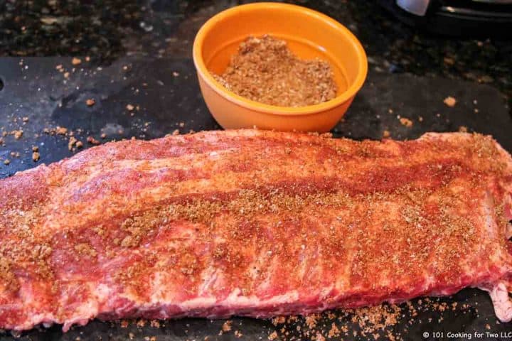 ribs with rub on black board