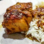 Image of honey garlic chicken on a white plate with rice