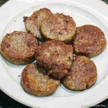 baked sausage on a white plate.