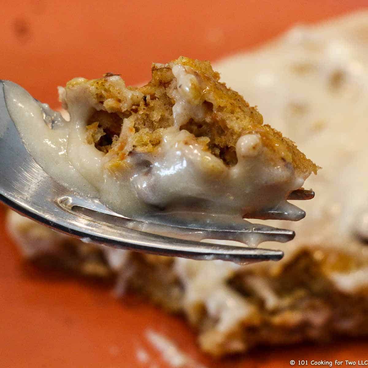 Carrot Cake Pancakes – Oven Baked from 101 Cooking For Two bite of carrot cake pancake on fork