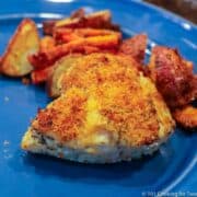 Sheet pan chicken with potatoes and carrots on plate