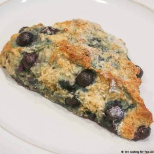 blueberry scone on white plate