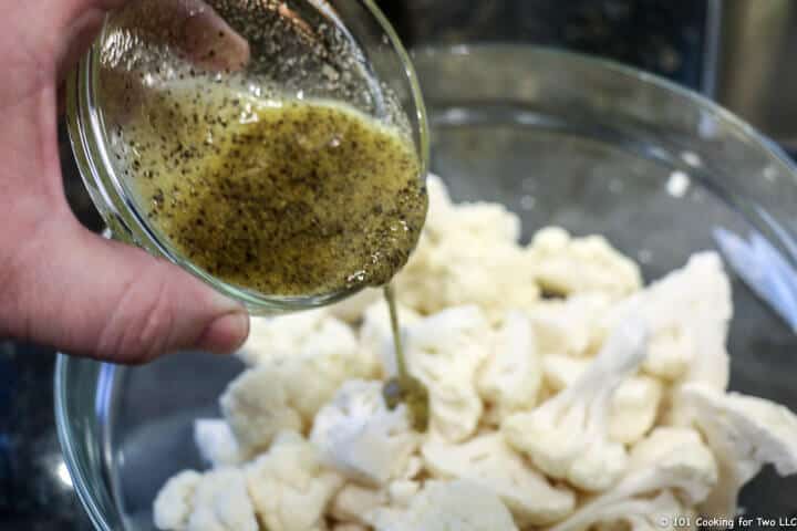 pouring coating over cauliflower
