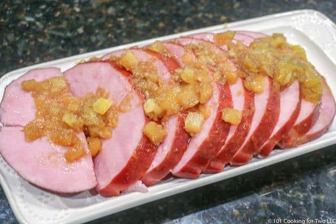 image of cut ham with pineapple on serving plate