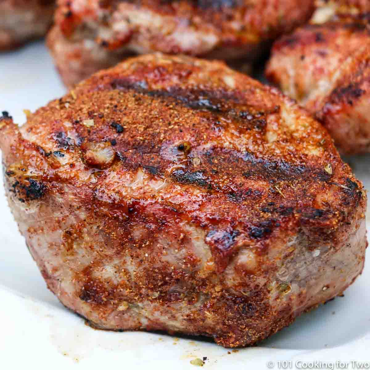 Pork Tenderloin Medallions on a white plate.