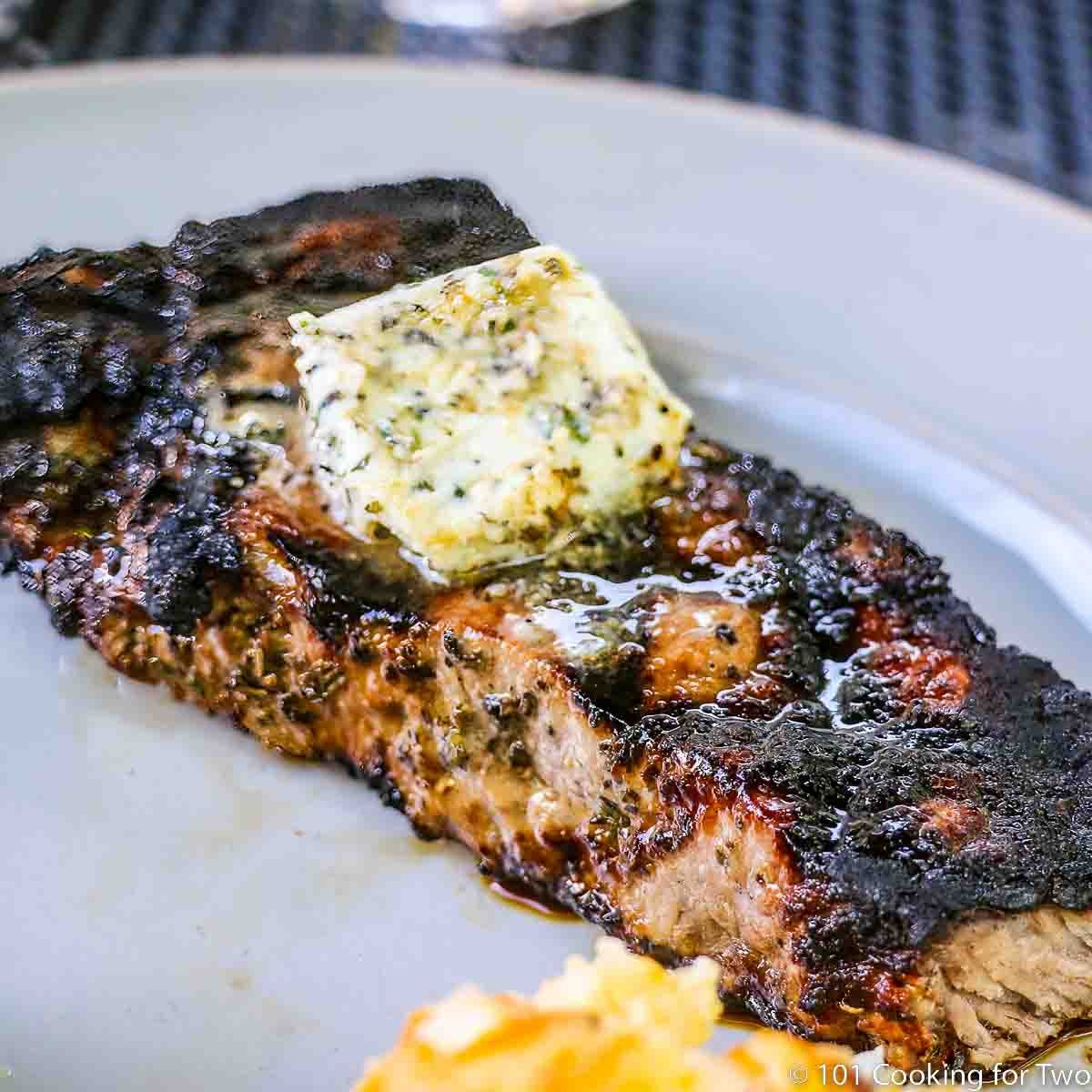Image of Blue Cheese and Garlic Compound Butter on a strip steak