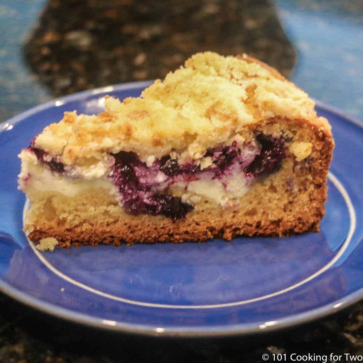 Blueberry Cream Cheese Coffee Cake on a blue plate