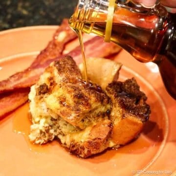 French Toast Casserole on orange plate with syrup.