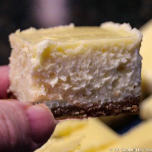 Image of a cheesecake bars being held