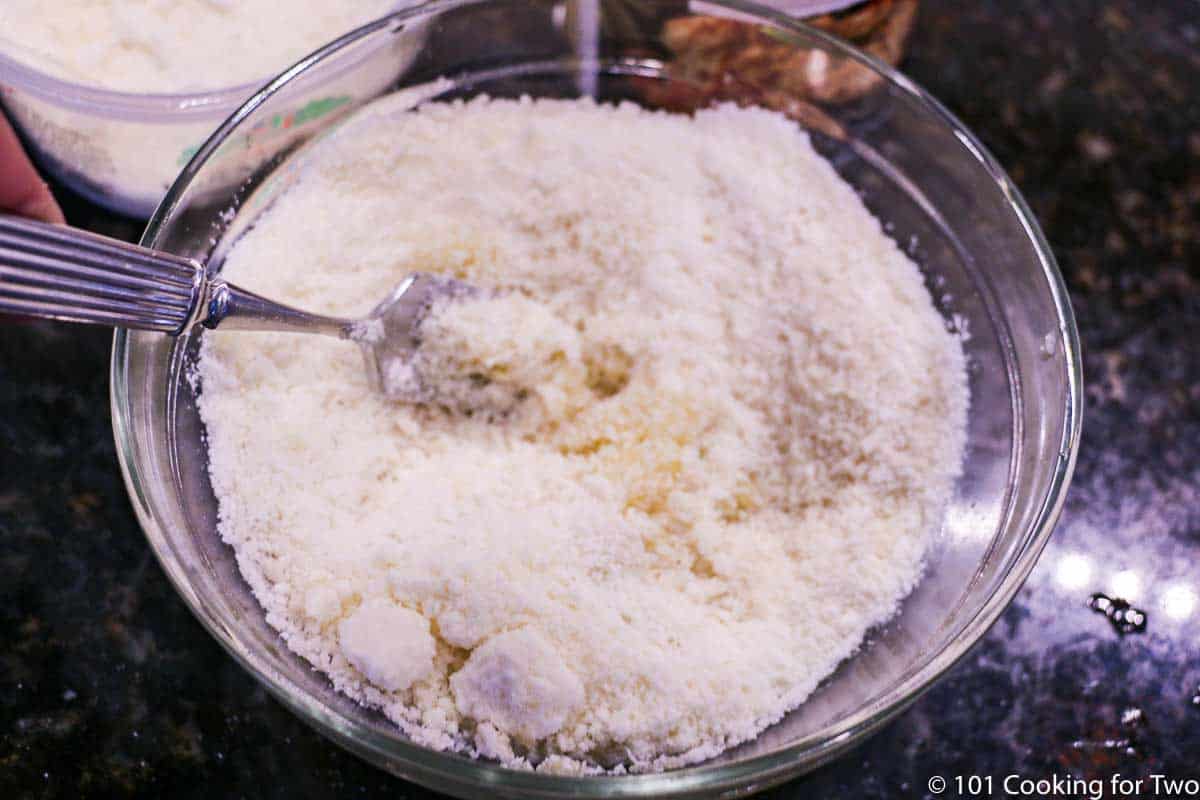 Mixing topping ingredients in small bowl.