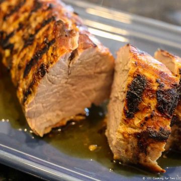 grilled pork tenderloin cut on blue tray