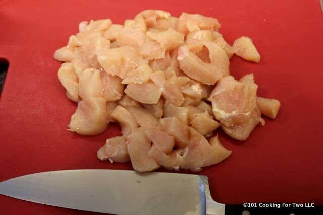 picture of the prepped chicken on a red cutting board