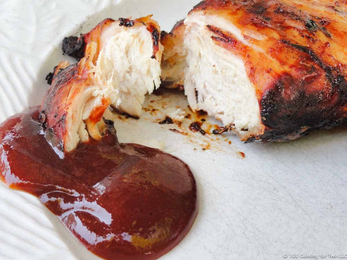 BBQ chicken breast with sauce on plate