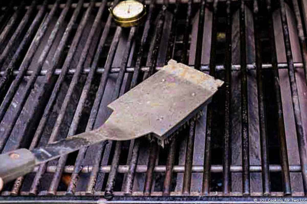 cleaning grill with brush