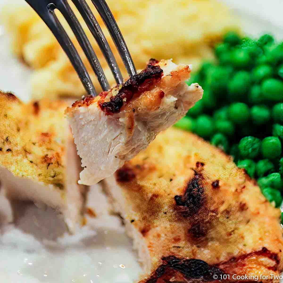 Parmesan Baked Chicken Breast on a fork