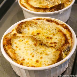 French Onion in a bowl covered with browned cheese