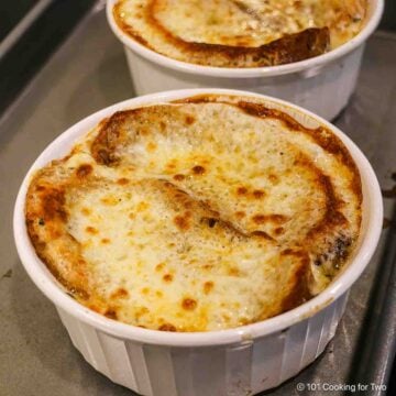 French Onion in a bowl covered with browned cheese