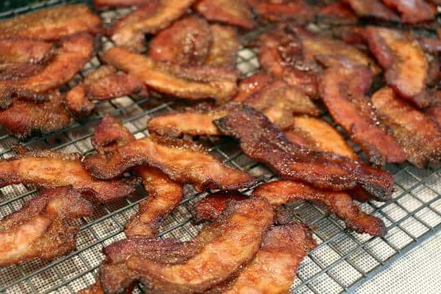 candied bacon cooling on a rack