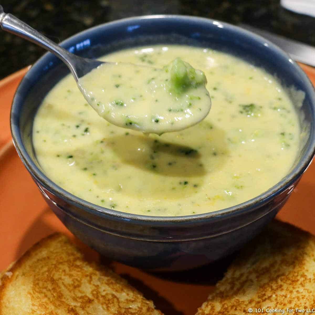 broccoli cheese soup in blue bowl