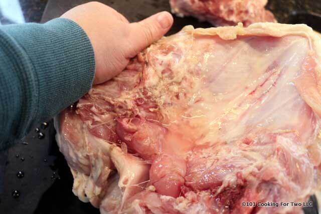 image of breaking back the rib section of the breast to make a flatter bottom