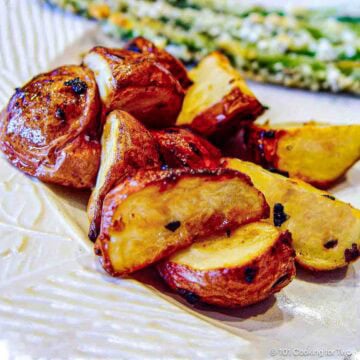 Roasted baby potatoes on a white plate