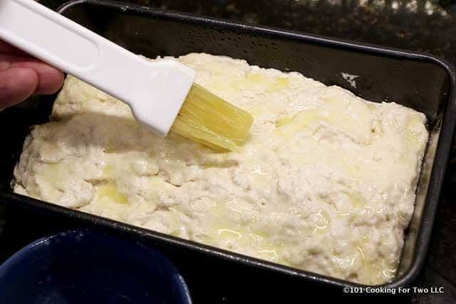 image of brushing top of the dough with butter