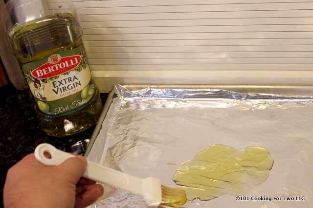 prepare baking tray lined with foil and brushing on olive oil