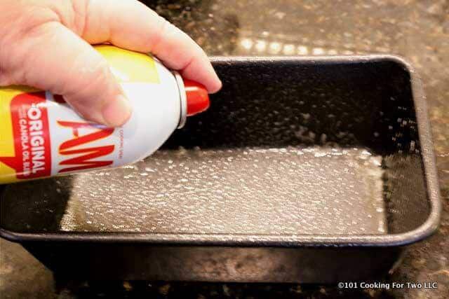 image of spraying a loaf pan with PAM