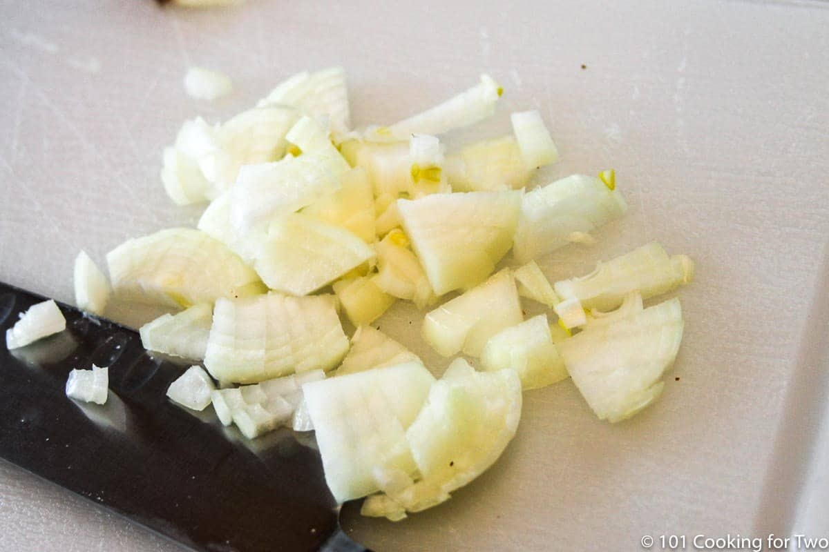 Chopped onion on white board