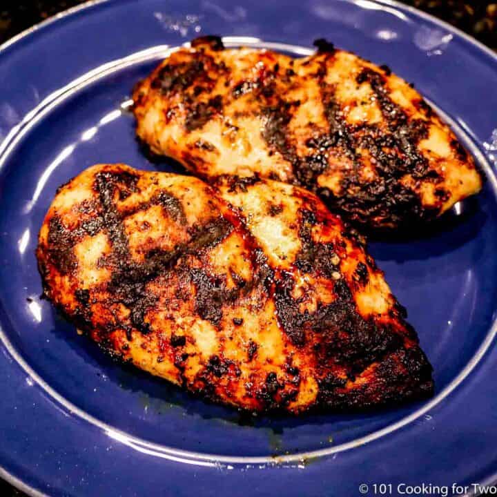 Marinaded chicken breast on a white plate