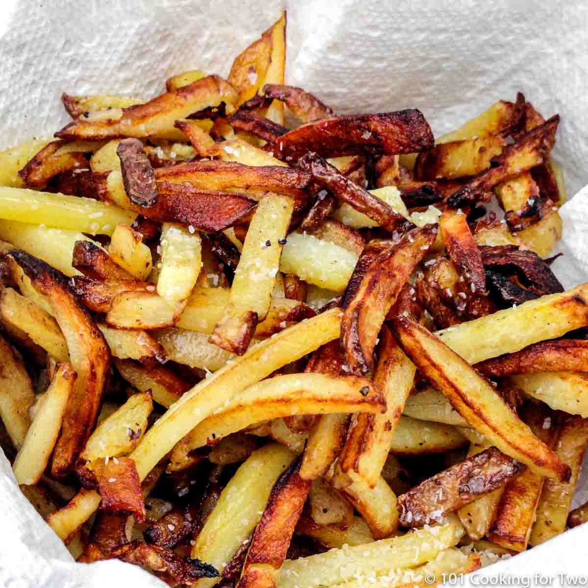 fries in white bowl with towels